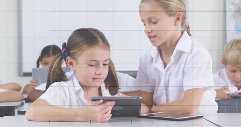 Young Students Collaborating on Tablets in Modern Classroom