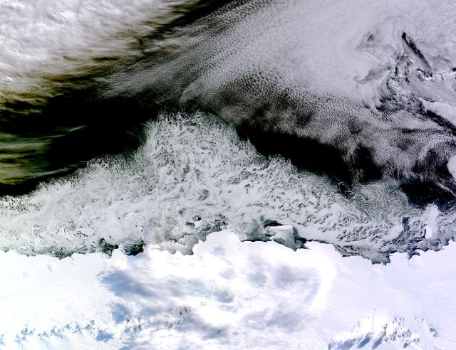 This natural-color imagery, captured on April 5, 2015, by the MODIS on NASA’s Terra satellite, shows sea ice along Princess Astrid Coast in East Antarctica. Areas near the continent are covered in sea ice, while clouds occupy the northeast corner. Ideal for educational materials on climate change, geological studies, and environmental observation, this image aids in distinguishing between sea ice and clouds using false-color techniques.