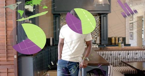 Leaning Man on Kitchen Island Wearing White T-Shirt Displaying AR Pie Charts Data Overlay
