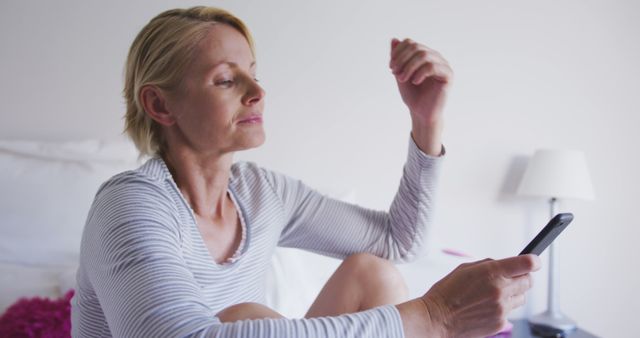 Relaxed Middle-Aged Woman Using Smartphone at Home - Download Free Stock Images Pikwizard.com