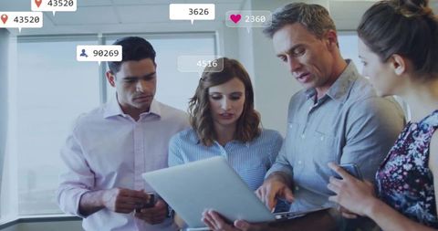 Business Team Analyzing Marketing Data on Laptops