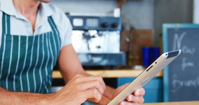 Barista Managing Cafe with Tablet - Download Free Stock Images Pikwizard.com