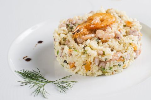 Gourmet seafood risotto with shrimp garnish