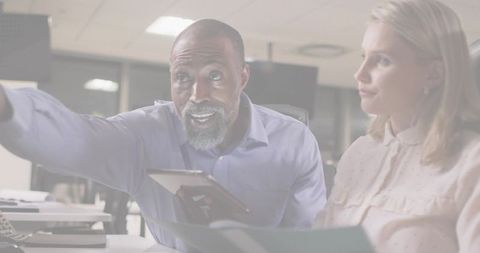 Business Professional Pointing Tablet in Office Collaboration Scene