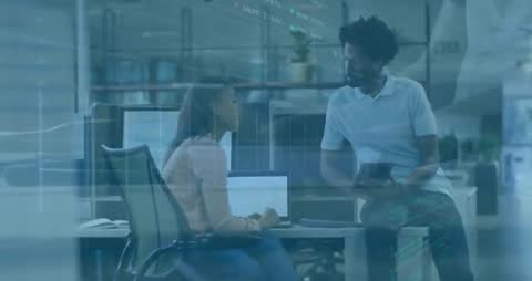 Collaborative Office Team Analyzing Data on Digital Devices