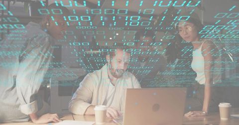 Team collaborating around laptop with binary overlay for data analysis and cybersecurity