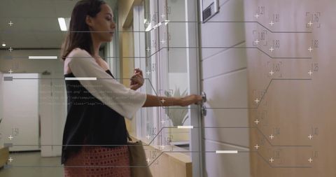 Businesswoman Analyzing Data with Virtual Overlay in Office