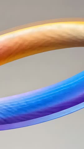 Rotating Undulating Tubular Ribbon Loop Vertical Motion with Shifting Gradient Colors