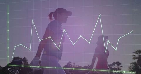 Female Golfers Analyzing Performance Data Outdoors