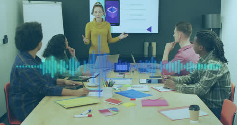 Diverse Business Team Engaged in Innovative Tech Presentation