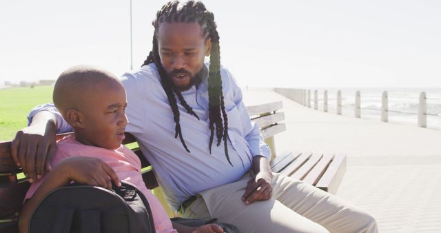 Father Comforting Upset Son on Park Bench by Beach - Download Free Stock Images Pikwizard.com