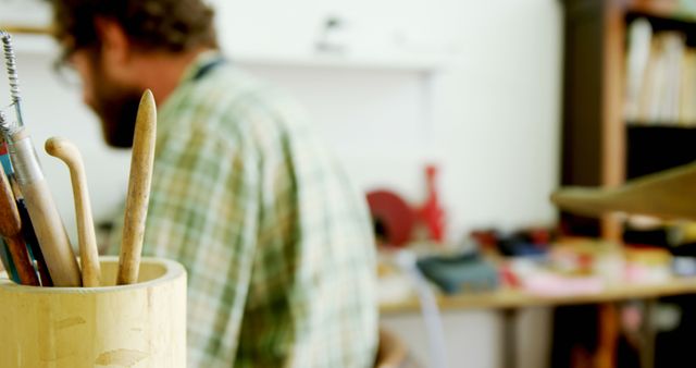 Focused Artisan Working in Studio with Clay Sculpting Tools - Download Free Stock Images Pikwizard.com