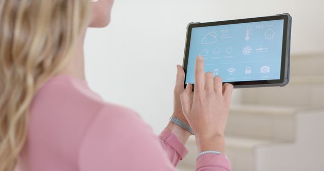 Woman Controlling Smart Home Using Digital Tablet - Download Free Stock Images Pikwizard.com