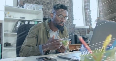 Businessman analyzing data metrics during lunch break