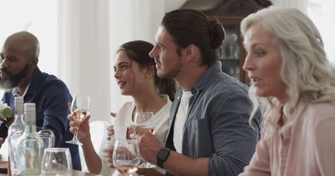 Guests Enjoying Wine and Conversation at Wedding Reception