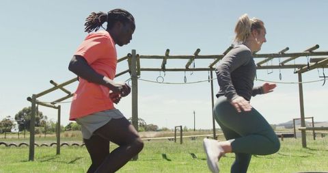 Diverse Individuals Training on Outdoor Obstacle Course