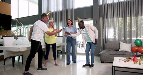 Diverse Colleagues Celebrating with Sparklers in Corporate Lounge