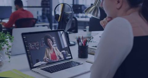 Remote Meeting with Colleague in Modern Office Setting