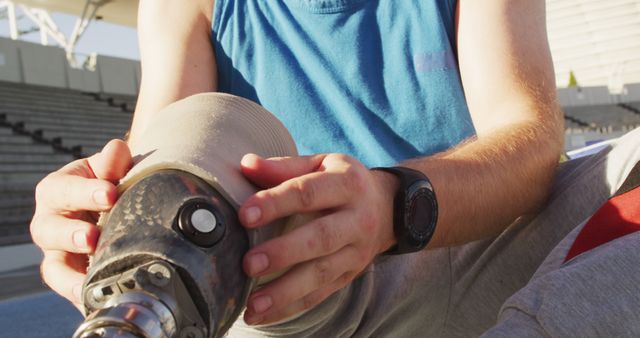 Male athlete with prosthetic leg adjusting socket - Download Free Stock Images Pikwizard.com