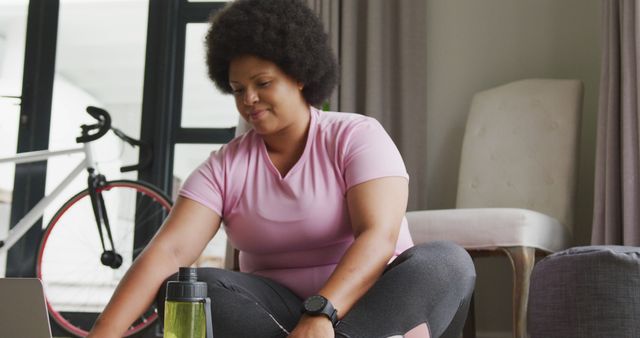 Image of midsection of plus size african american woman in sport clothes preparing for exercising - Download Free Stock Photos Pikwizard.com