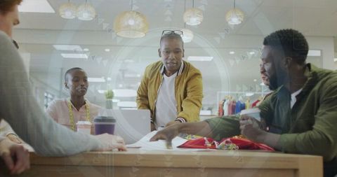 Creative Fashion Designers Collaborating in Modern Studio Environment