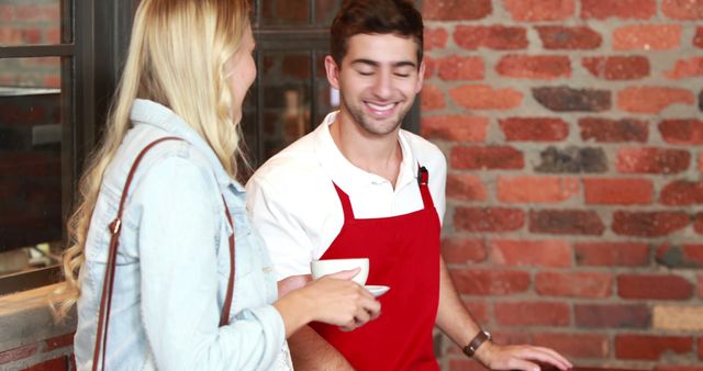 Smiling Barista Interacting with Female Customer in Coffee Shop - Download Free Stock Images Pikwizard.com