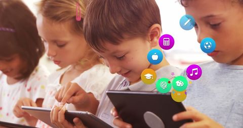 Diverse children engaged with educational tablets and digital interface