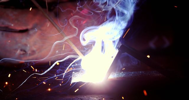 Close-Up of Welding Process with Sparks and Smoke - Download Free Stock Images Pikwizard.com