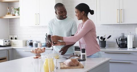 Couple Crafting Homemade Breakfast in a Contemporary Kitchen