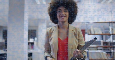Modern Professional Woman Holding Tablet in a Library
