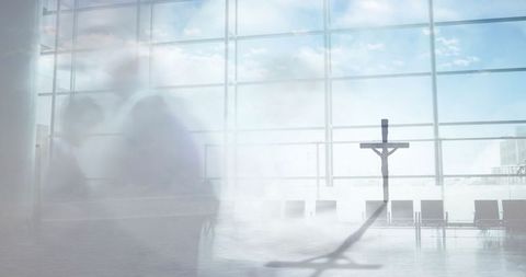 Crucifix Casting Shadow in Modern Airport Terminal