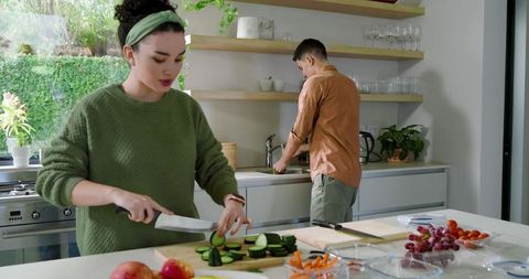 Young Couple Cooking Together in Modern Kitchen