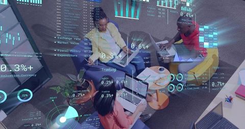 Collaborating team analyzing real-time dashboards on laptops with augmented data overlays