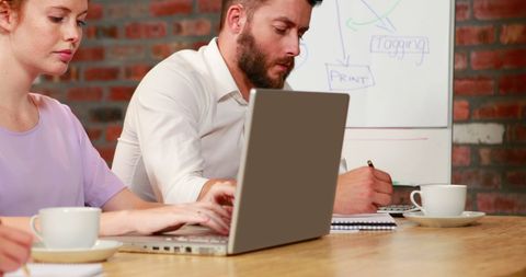 Collaborative Team Working on Project in Modern Office