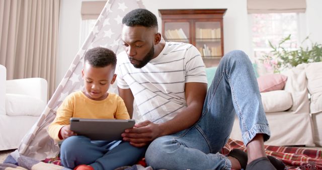 African American Father and Son Using Digital Tablet Together - Download Free Stock Images Pikwizard.com