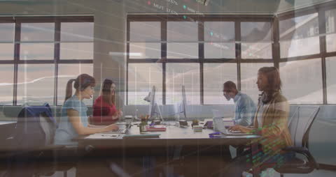 Diverse Business Team Collaborating with Stock Market Data Overlay