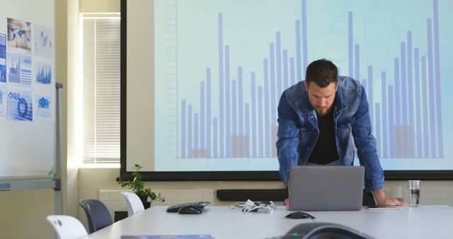 Young Businessman Analyzing Data During Presentation in Conference Room - Download Free Stock Images Pikwizard.com