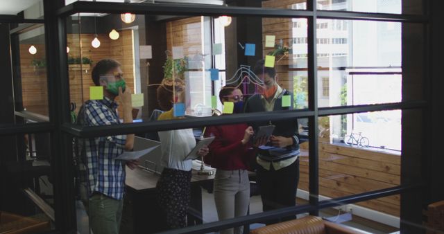 Diverse Team Brainstorming in Modern Office with Glass Walls - Download Free Stock Images Pikwizard.com