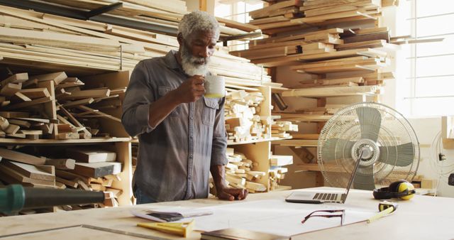 Mature Craftsman Enjoying Coffee Break in Woodworking Studio - Download Free Stock Images Pikwizard.com