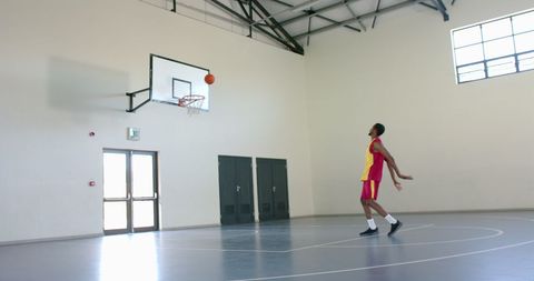 Man Practicing Basketball Shooting in Indoor Court - Download Free Stock Images Pikwizard.com