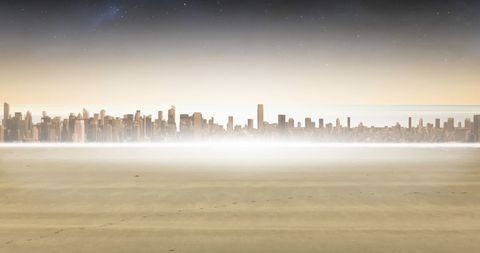 Mysterious city skyline emerging from ethereal mist