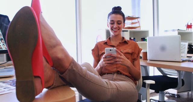 Businesswoman Relaxing in Office Checking Phone - Download Free Stock Images Pikwizard.com