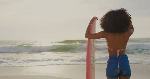 Young Female Surfer Holding Surfboard on the Beach - Download Free Stock Images Pikwizard.com
