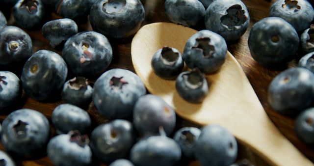 Close-up of fresh blueberries on wooden table 4k