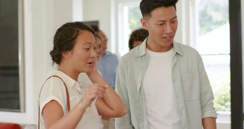 Guests greeting each other at wedding convention hall