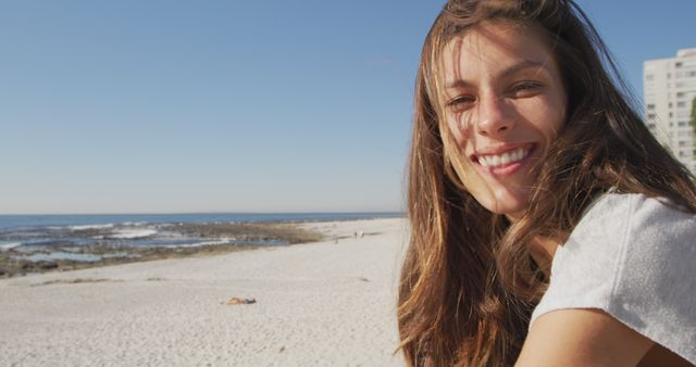 Happy Woman Smiling on Beach with Ocean Background on Sunny Day - Download Free Stock Images Pikwizard.com