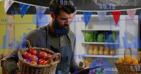Market vendor analyzing sales data holding basket of tomatoes and clipboard at stall