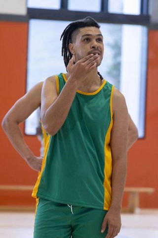 Basketball Player Taking Breath During Intense Game