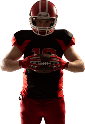 American football player holding ball in athletic pose transparent