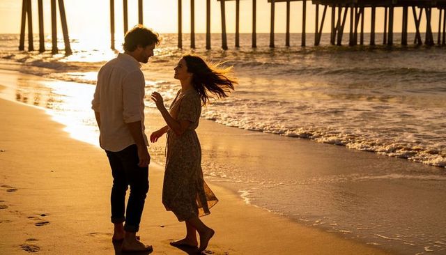 Romantic couple walking at sunset on pier beach barefoot golden hour silhouette